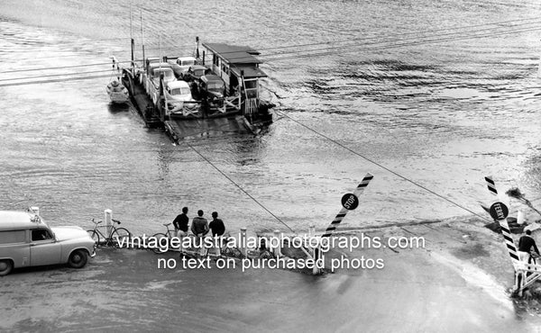 Barge moving cars and people